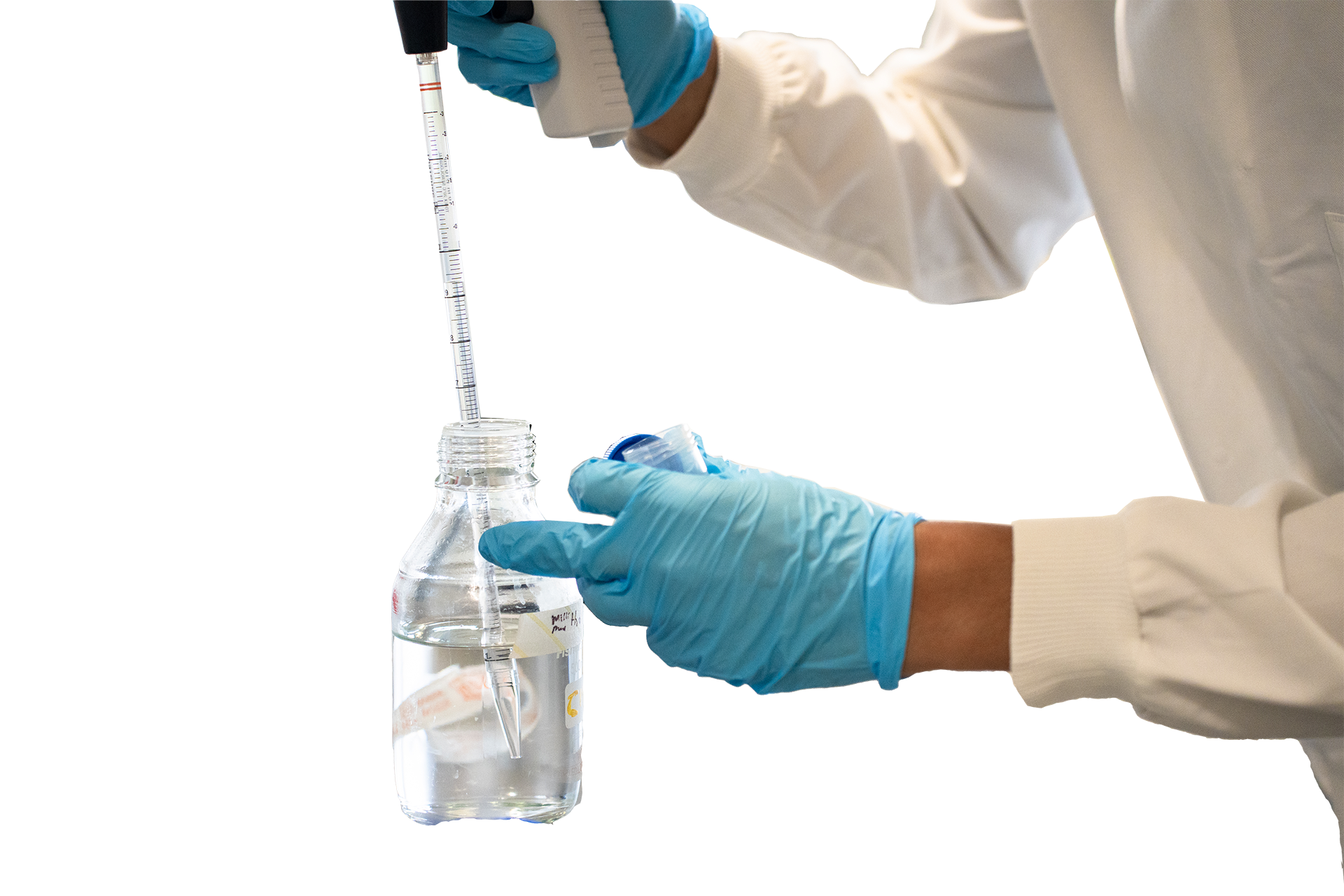 Isolated image of students hands in lab doing science